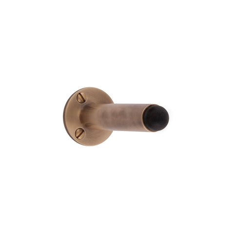 Skirting Mounted Door Stop. Face Fixed. 40mm Rose Dia. - Shown in Very Light Aged