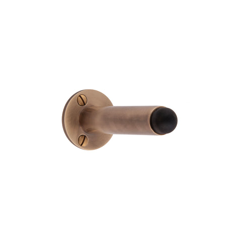Skirting Mounted Door Stop. Face Fixed. 40mm Rose Dia. - Shown in Very Light Aged